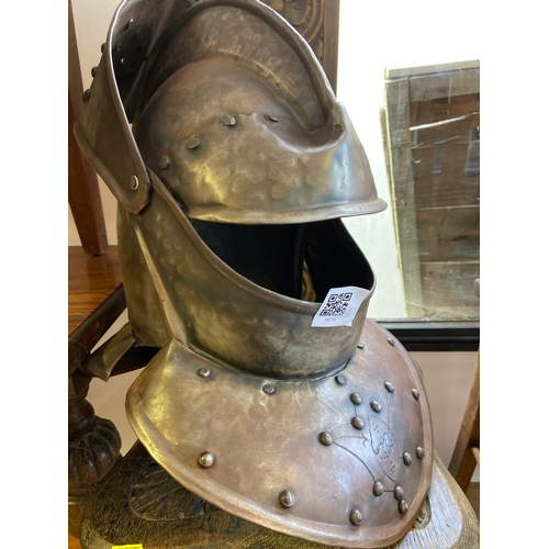 406 - Replica of a medieval Knights helmet with intricate metal work and general close to actual size.