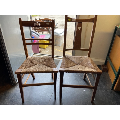 407 - Two Rush seated kitchen chairs with heart cut-out, not matching. 