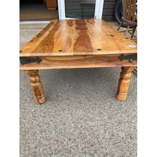 504 - Indonesian mahogany style coffee table. W136 x D76 x H42cm