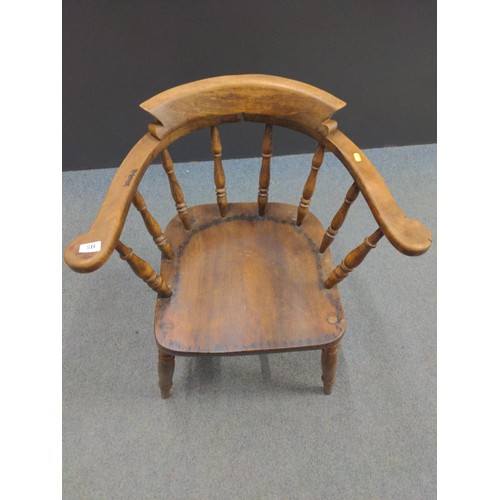 511 - Early C20 smokers bow chair. Previous seat pad has been removed.