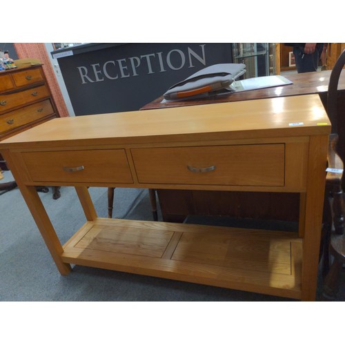 518 - 2 drawer oak side unit. L132cm D39cm H82cm