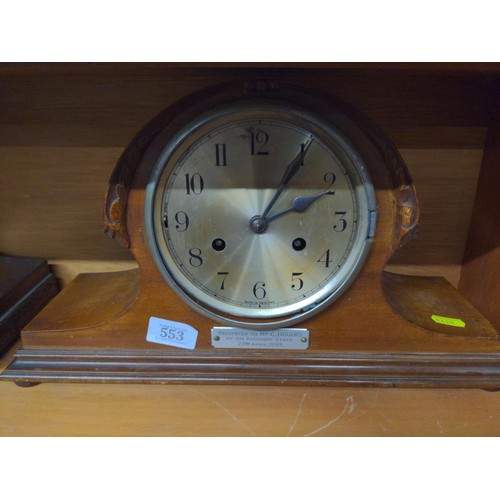 553 - Two oak admiral's hat mantle clocks: one with presentation plaque dated 1933 (missing glass & be... 