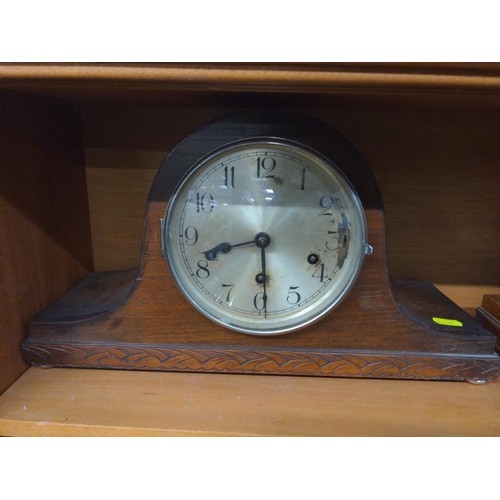 553 - Two oak admiral's hat mantle clocks: one with presentation plaque dated 1933 (missing glass & be... 