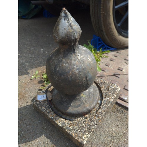 85 - Metal finial on concrete base H38cm