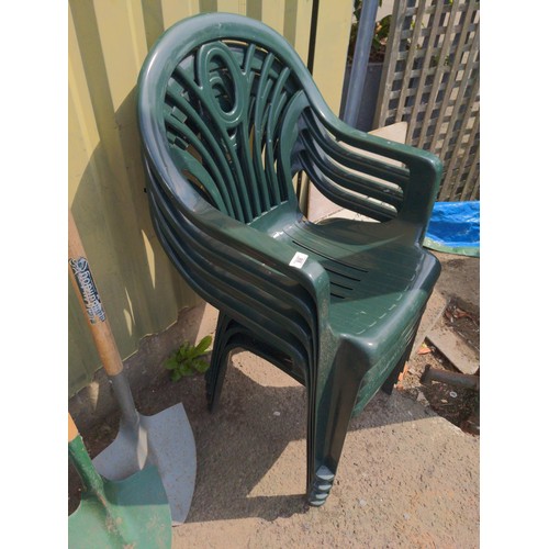 88 - Stack of four plastic garden chairs