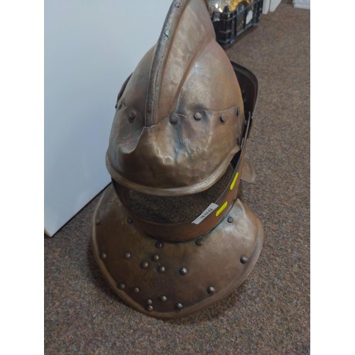 406 - Replica of a medieval Knights helmet with intricate metal work and general close to actual size.