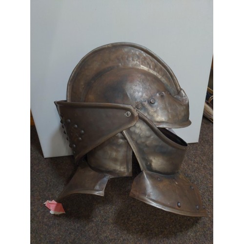 406 - Replica of a medieval Knights helmet with intricate metal work and general close to actual size.