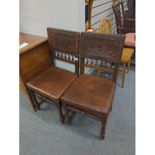 410 - Pair of worked leather dining chairs