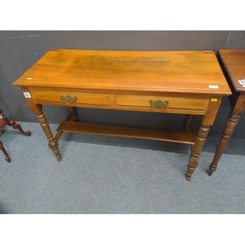 440 - Two drawer hardwood desk/ consul table. W107 D 47 H 73 cm with original castors.