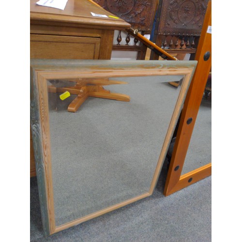 443 - Pine framed mirror 64cm x 87cm & a framed bevelled mirror 43cm x 85cm.