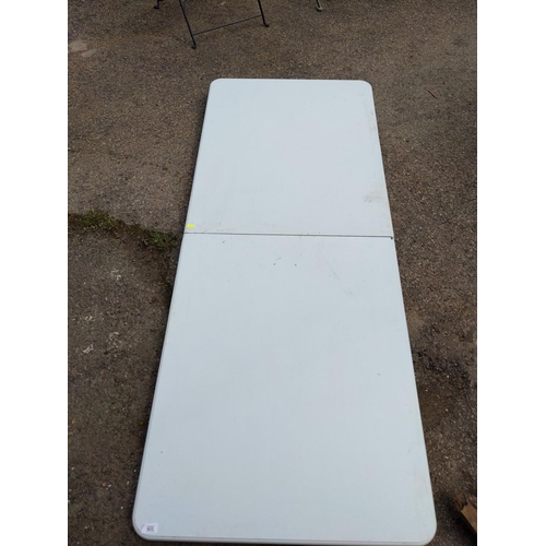 119 - plastic folding table 