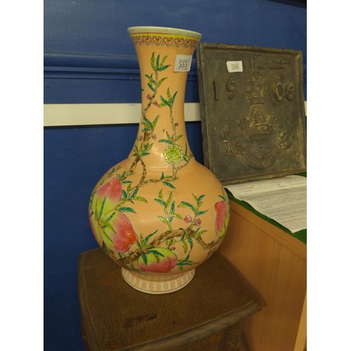 555 - A Chinese vase, bottle shaped with flared neck and decorated with nine peaches on an extensive peach... 