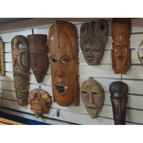 590 - Various tribal wall masks, mostly carved wood with one terracotta.