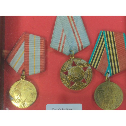 838 - Framed soviet medal trio and framed set of four space badges