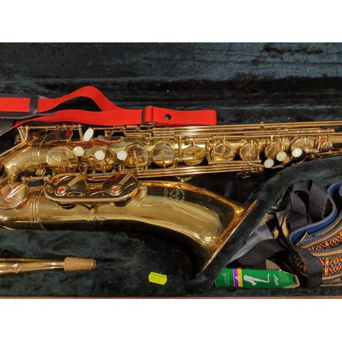 646 - Saxophone by Earlham Tenor in polished brass finish within black plush lined original case. Plus amo... 