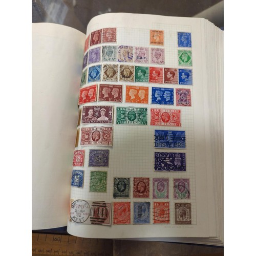 683 - Four stamp albums, partly filled with world stamps.