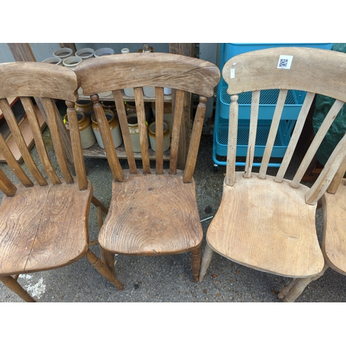 841 - 5 elm seated kitchen chairs. Some with damage/repair.