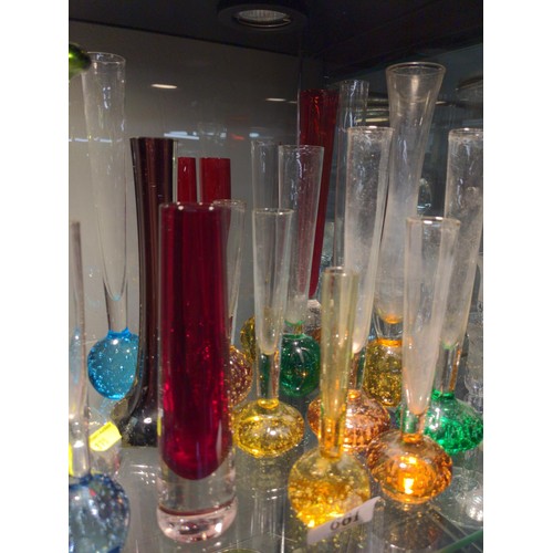 661 - Shelf of coloured glass vases with heavy bottoms and in various styles.