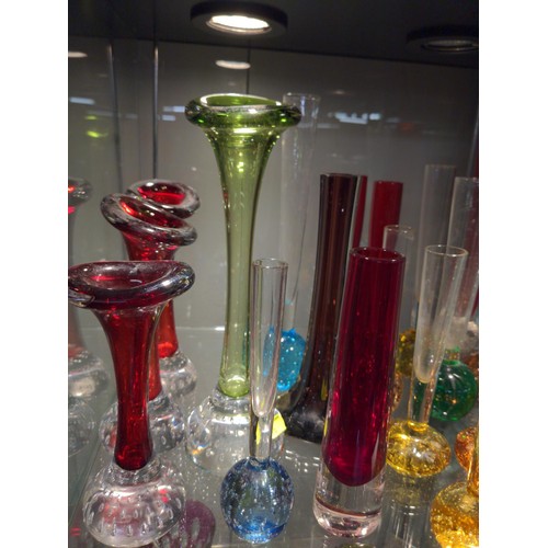 661 - Shelf of coloured glass vases with heavy bottoms and in various styles.