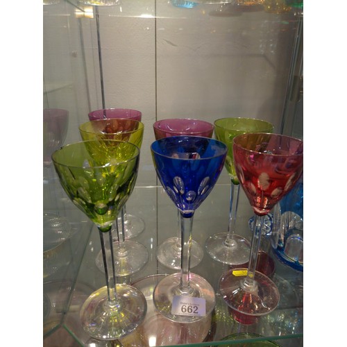 662 - Coloured glass decanter and seven hock glasses all in a mix of colours.