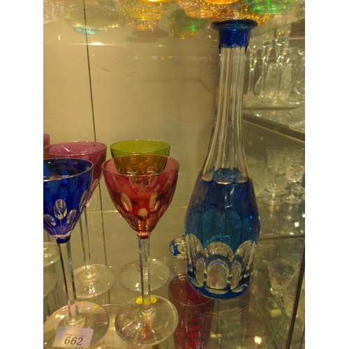 662 - Coloured glass decanter and seven hock glasses all in a mix of colours.