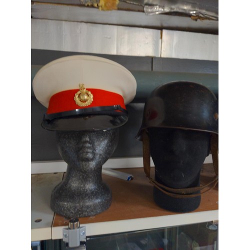 677 - Three RAF officers hats, one Royal Marines and one German WW2 Fire service plus, five assorted badge... 