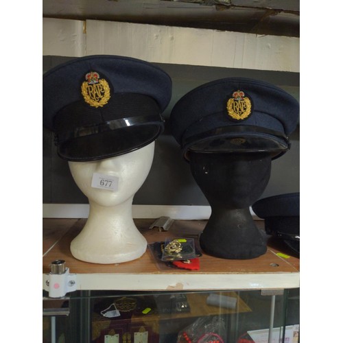 677 - Three RAF officers hats, one Royal Marines and one German WW2 Fire service plus, five assorted badge... 