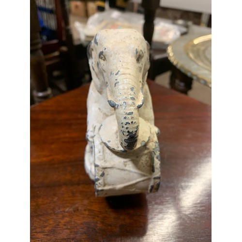 589 - Shelf of cast metal items inc. Elephant, mini door stop & bird drinker. elephant h12cm