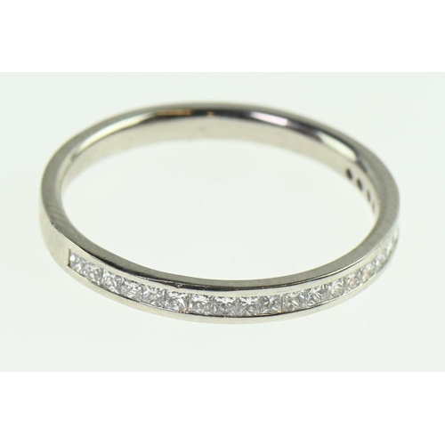 580 - White metal (tests positive for platinum) half eternity ring, channel set with 0.60 carat princess-c... 