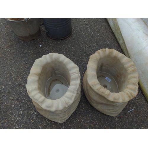 100 - Two small concrete sack planters W31cm x H23cm