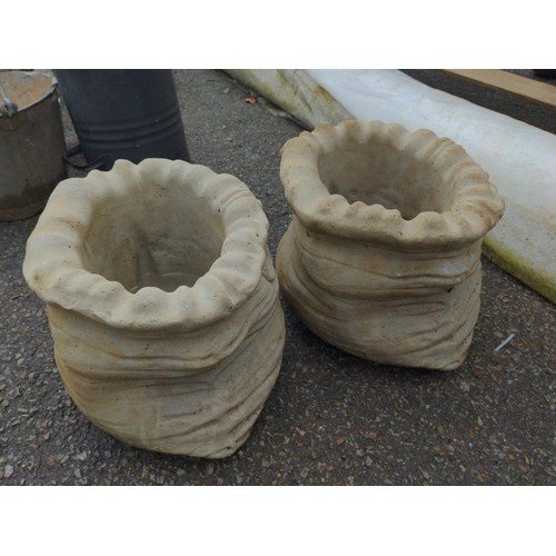 100 - Two small concrete sack planters W31cm x H23cm