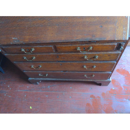 159 - Oak bureau with two over three drawers and internal stationary compartments, with key