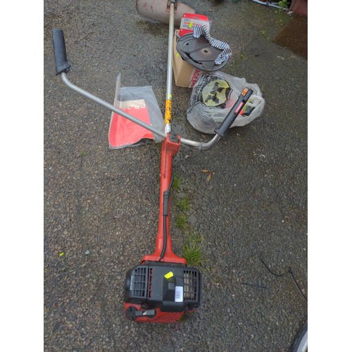 180 - Jonsered GR260 petrol strimmer with accessories and manual