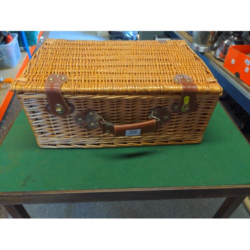 248 - Wicker Picnic basket with blanket and other contents