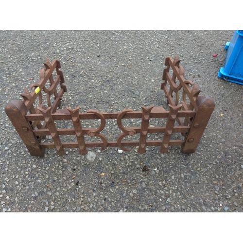 82 - wrought iron candle stand with cast iron fire crate