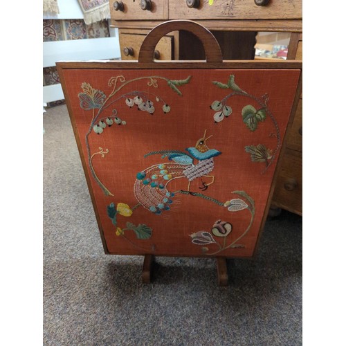 479 - Peacock embroidered oak fire screen. H63cm