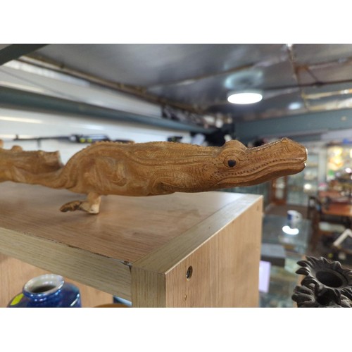 490 - Hardwood carved branch, decorated with Crocodilia. L83cm D40cm