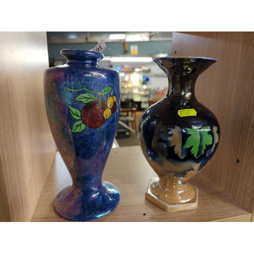 491 - 2 Iridescent finished vases. Largest H24.5cm