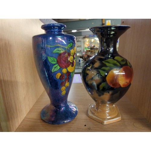 491 - 2 Iridescent finished vases. Largest H24.5cm