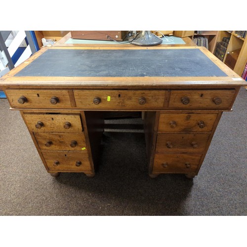 513 - Early C20 pedestal desk, with flanked 3 drawer units under single large drawer. W113cm D59cm H76cm