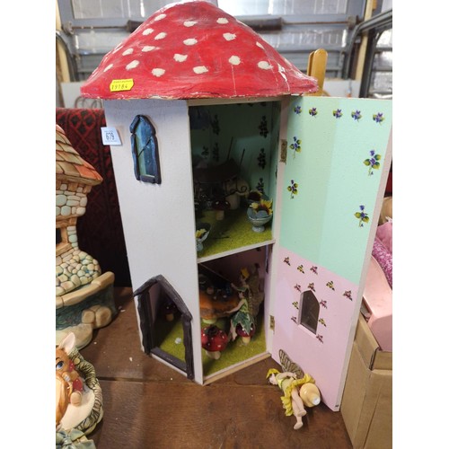 679 - Toadstool Fairy House with residents, ht 52cms, diameter 35 cms, made of wood