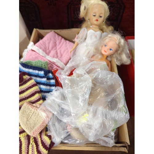 697 - 3 vintage dolls inc. Sindy, a baby doll crib, clothing & accessories