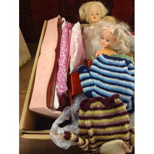 697 - 3 vintage dolls inc. Sindy, a baby doll crib, clothing & accessories