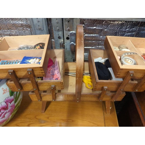Wooden concertina sewing box on legs. W43 D25 H44cm