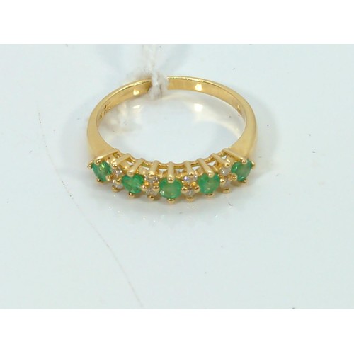 566 - Emerald and diamond ring set in 18ct gold, size P1/2, gross weight 3.22 grams