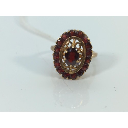 570 - 9ct gold and garnet cluster ring, size O, gross weight 4.5 grams