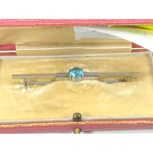 573 - 9ct white gold and blue topaz brooch, length 58mm, gross weight 3.4 grams