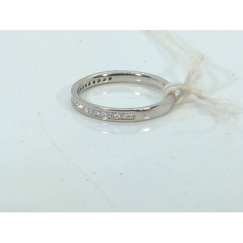 580 - White metal (tests positive for platinum) half eternity ring, channel set with 0.60 carat princess-c... 