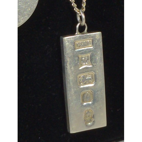 586 - Two silver ingot pendants with chains, gross weight 71.8 grams