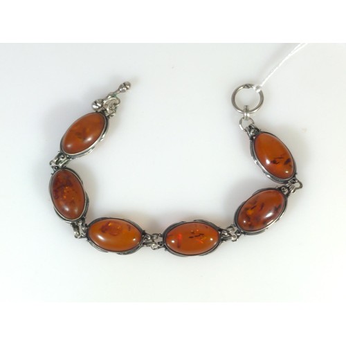 588 - Silver and amber bracelet, circumference 195mm, gross weight 19.2 grams